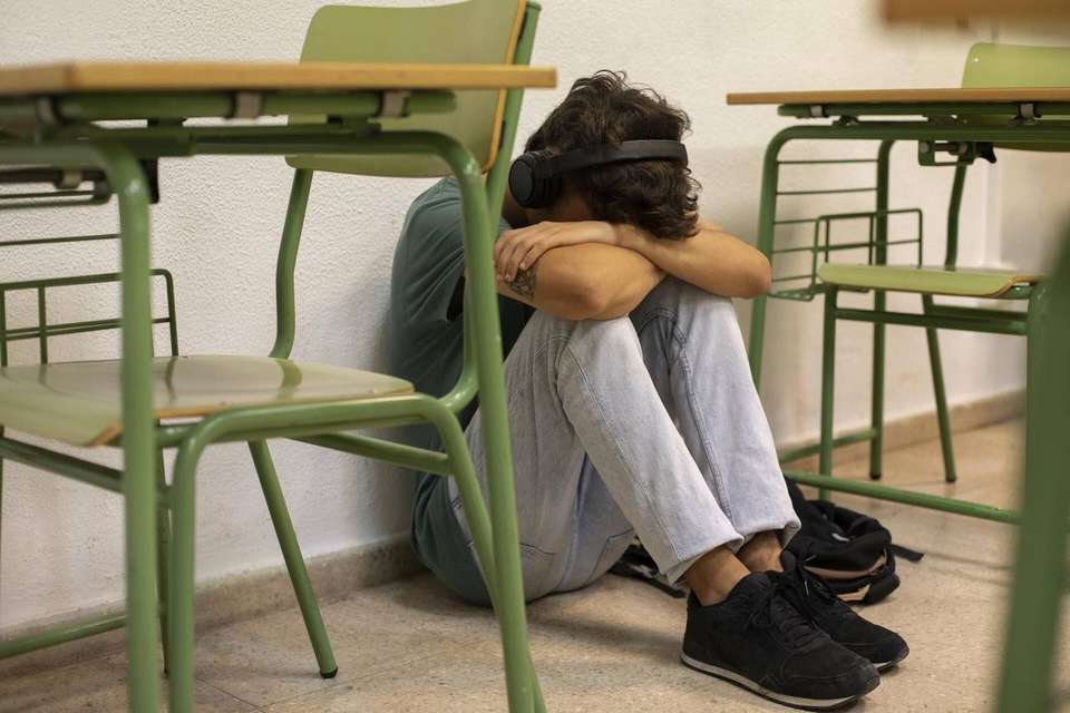 Sad teenager school full shot
